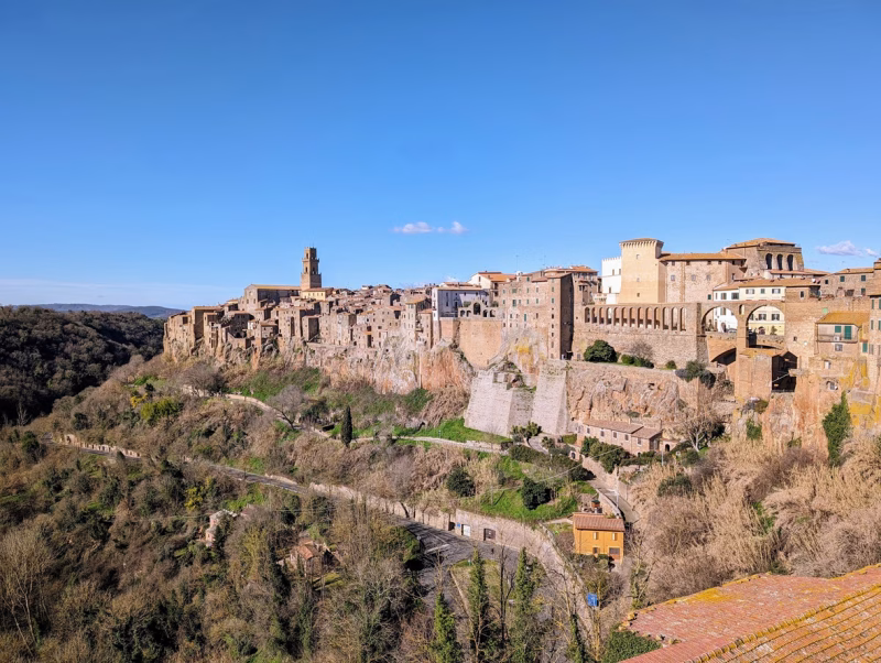 View of Pitigliano perched on its tufa cliff above the wooded valley in southern Tuscany