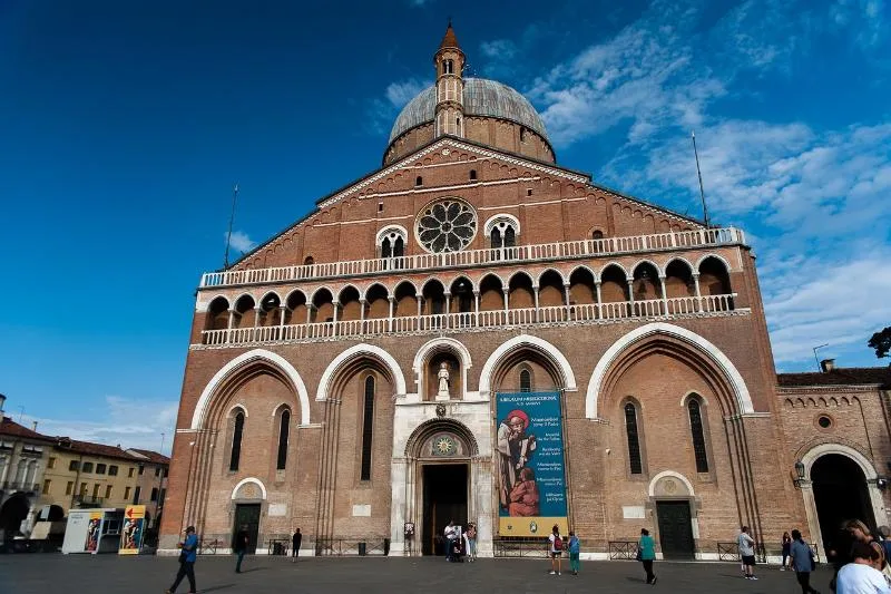 Brick façade, domes and rose window of the Basilica of Saint Anthony in Padova