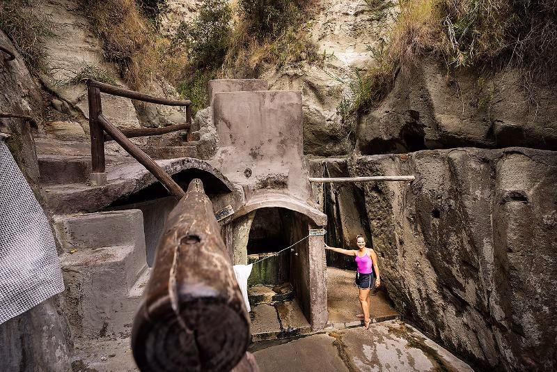 Rustic thermal structures within Cavascura’s gorge.