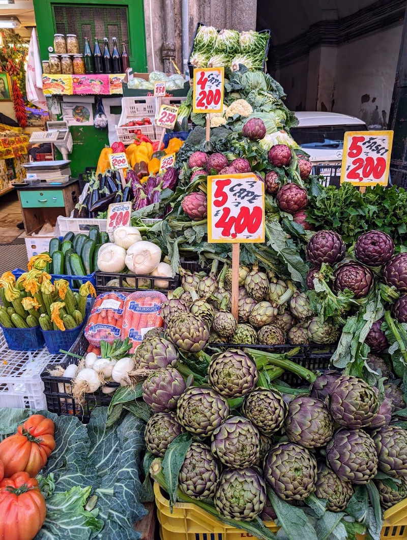 Artichokes and Vegetables in Naples Market Fresh artichokes and seasonal vegetables on display at a Naples market.