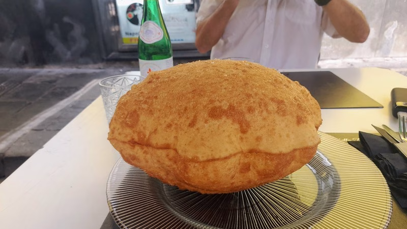 Pizza Fritta – Naples’ Fried Pizza Traditional Neapolitan pizza fritta served at a street table.