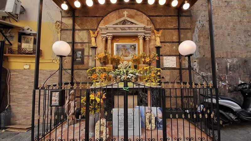 Street shrine with flowers in Rione Sanità, Naples