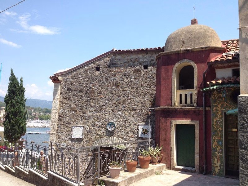 Historic seaside chapel in Scario, overlooking the marina and hills of southern Cilento.