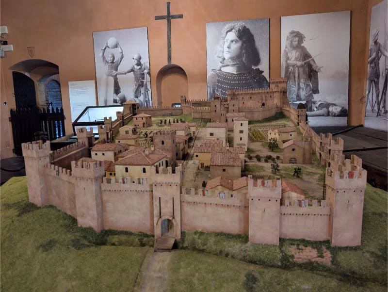 Detailed scale model of Gradara Castle and its fortified village inside the museum