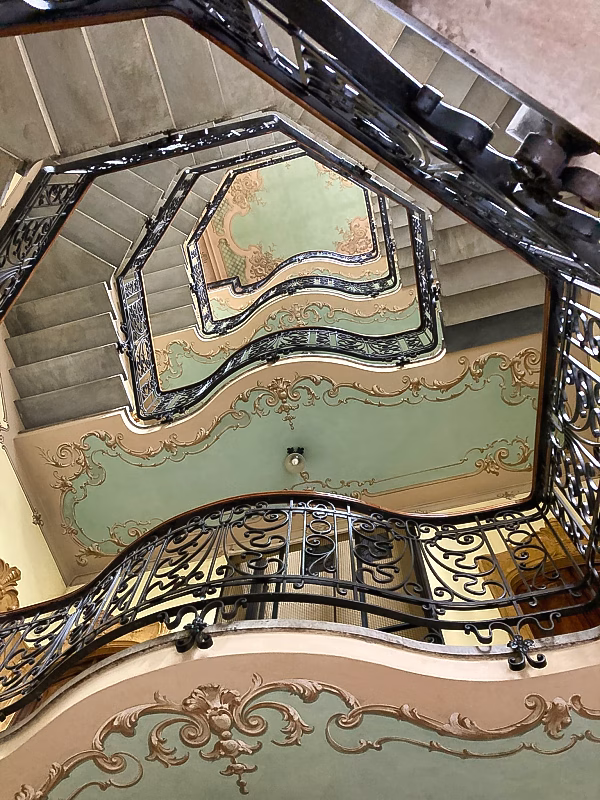 Liberty stairwell with wrought-iron balustrades Liberty stairwell with wrought-iron balustrades and painted ceilings in Turin