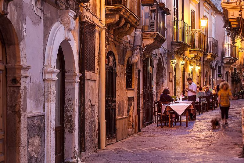 Evening street scene in Ortigia, Siracusa, Sicily, Italy