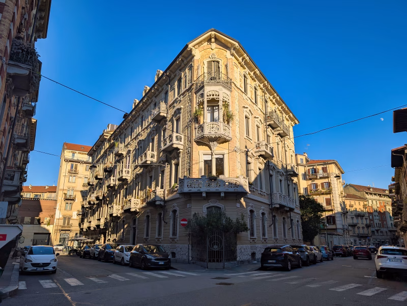 Casa Tasca, Turin Casa Tasca, Turin, early 20th-century Liberty apartment building on a corner plot with continuous balconies and decorative stucco façade