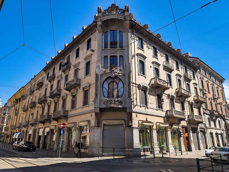Palazzo Nizza Florio in Turin, a late-19th-century corner palazzo with sculpted stonework, iron balconies, and ground-floor porticoes.