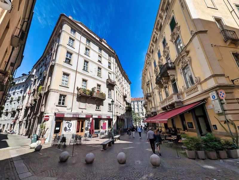 Small pedestrian street with cafés in the Quadrilatero Romano, Turin.