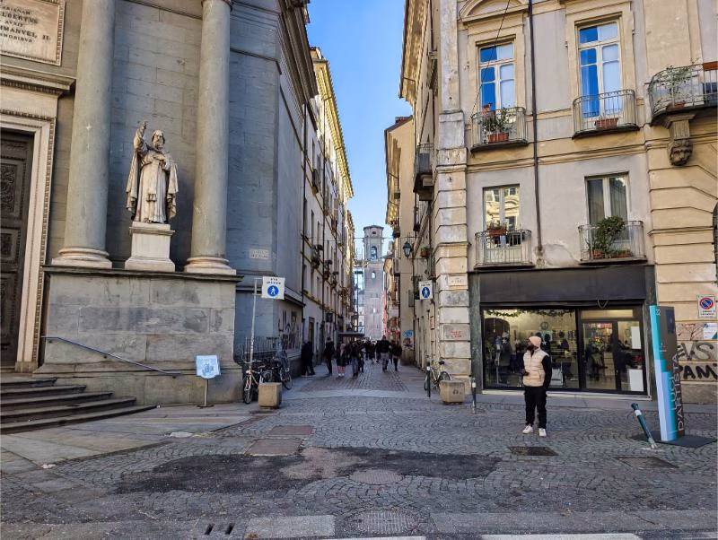 Intersection of historic streets near a church in the Quadrilatero Romano, Turin.
