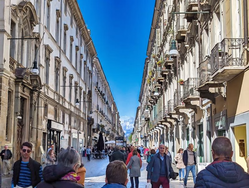 Via Garibaldi in Turin, a long straight pedestrian street lined with historic buildings in the Quadrilatero Romano.
