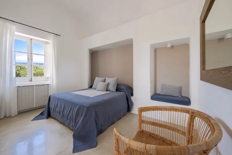 Superior Faro room in the historic lighthouse building at Capofaro Resort