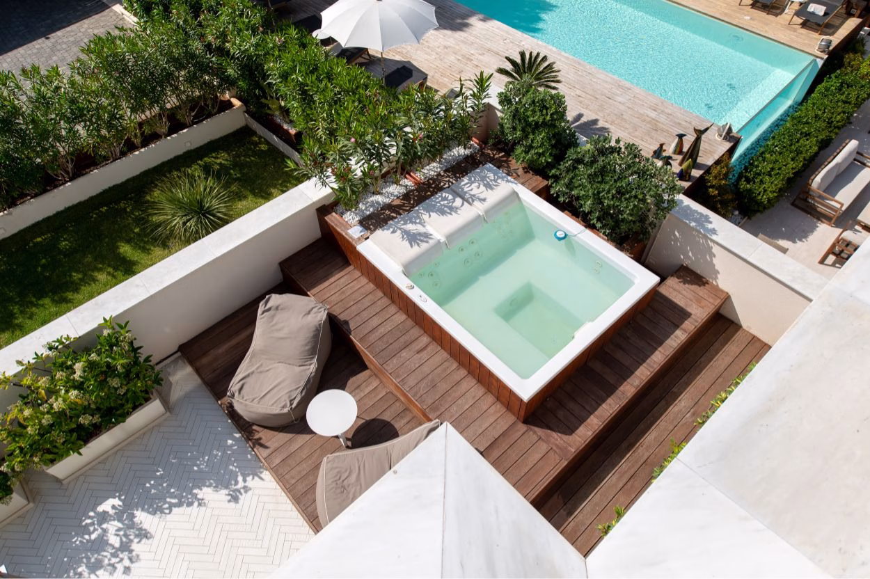 Solarium and pool area at Unìco Boutique Hotel d’Arte