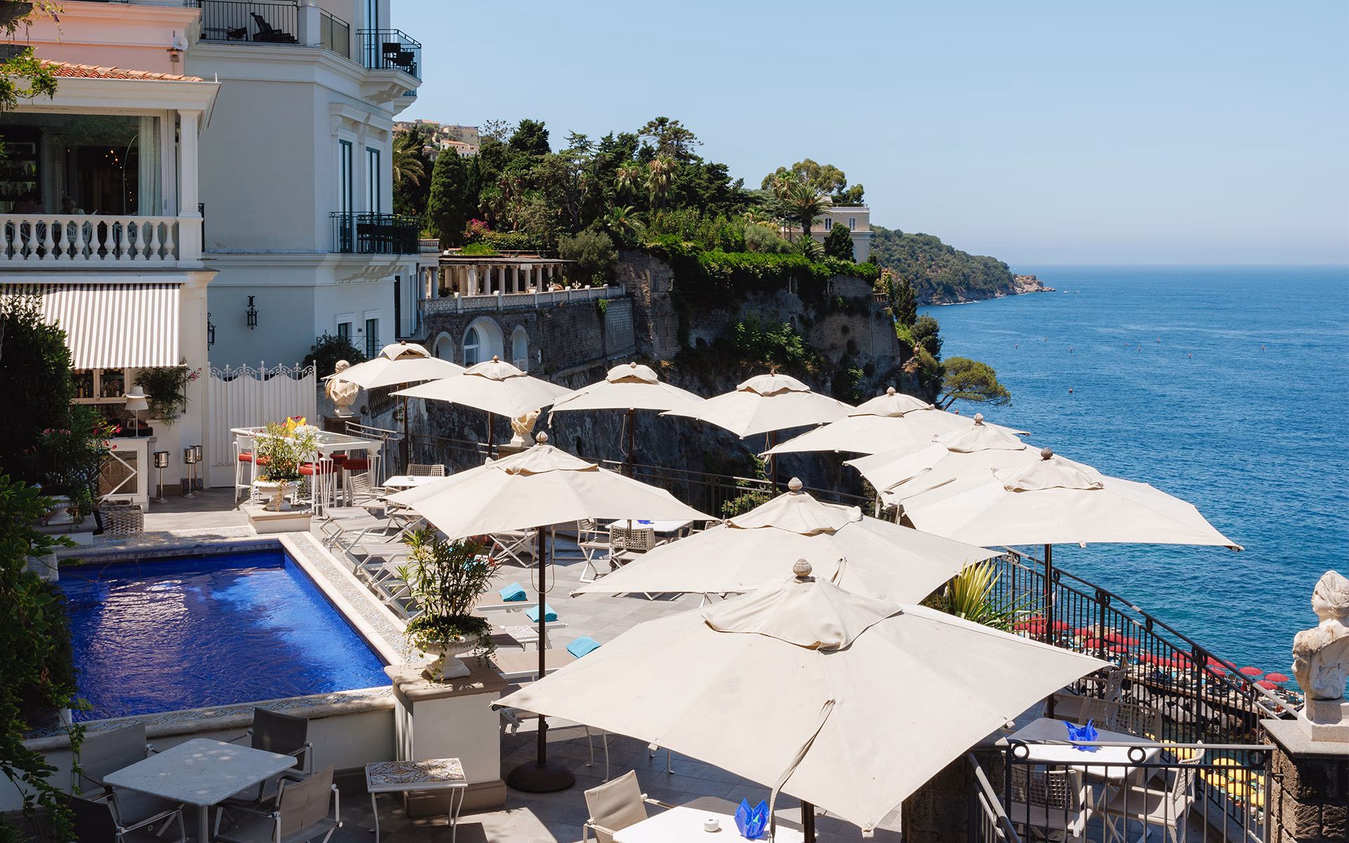 Outdoor pool and sea-facing terraces at Bellevue Syrene