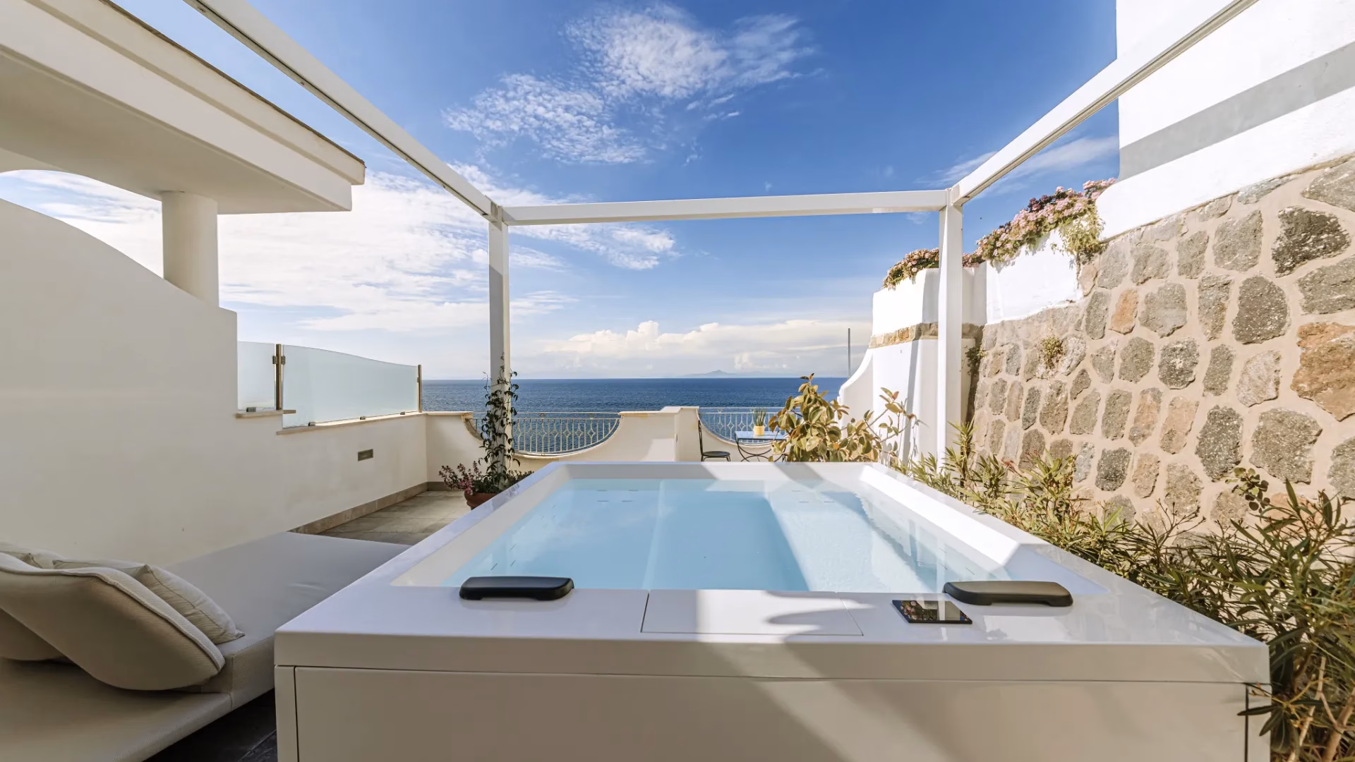 Junior Suite with private Jacuzzi terrace overlooking the sea at La Madonnina Hotel