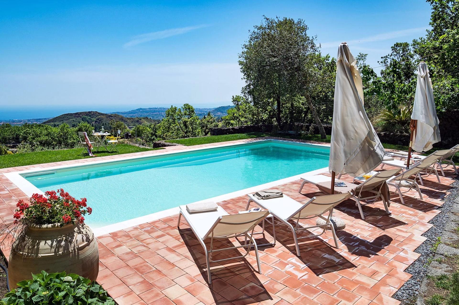 Saltwater swimming pool and sun terrace at Villa La Capita