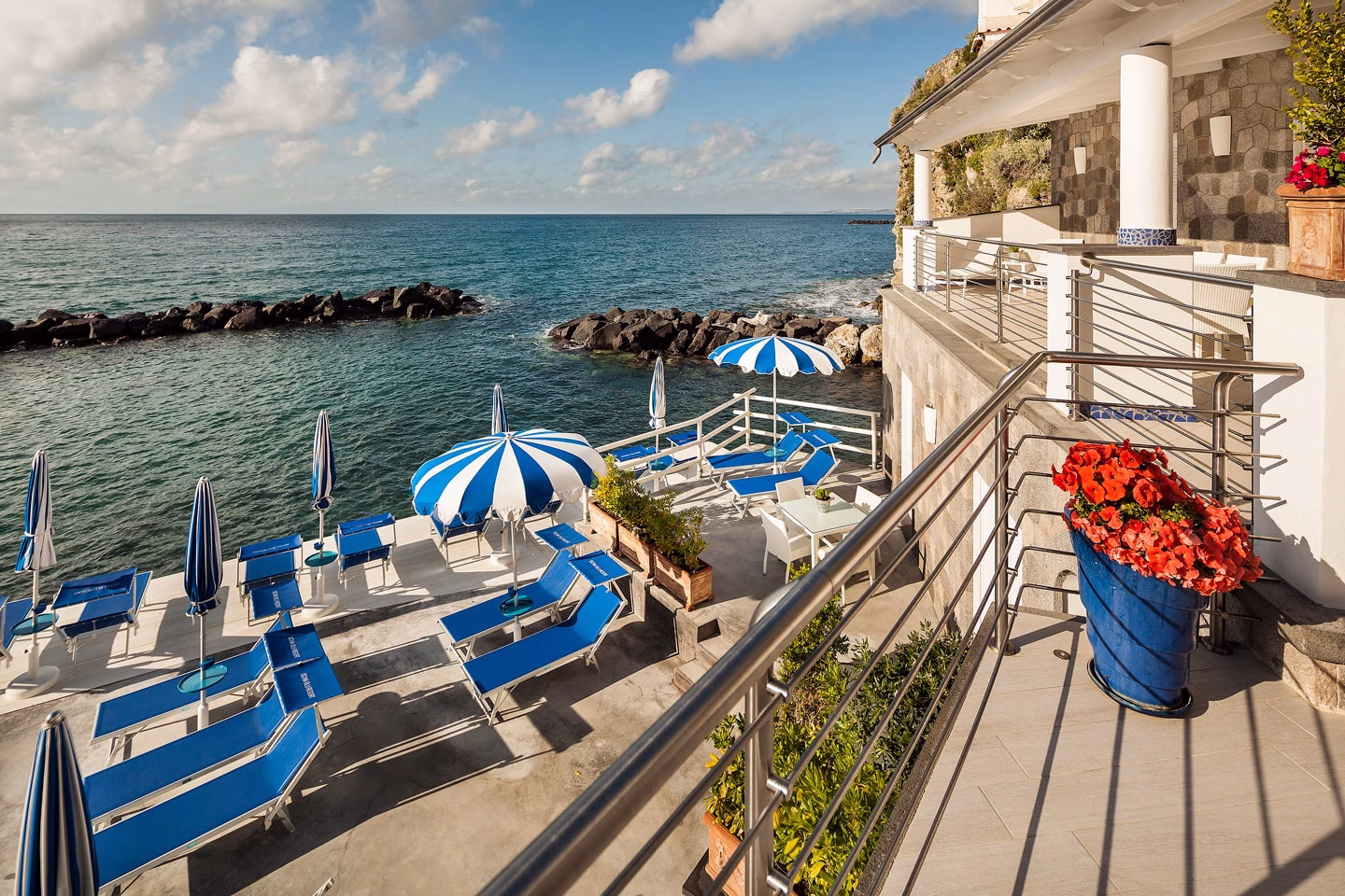 Sun loungers on the sea-facing solarium at Ischia Blu Resort