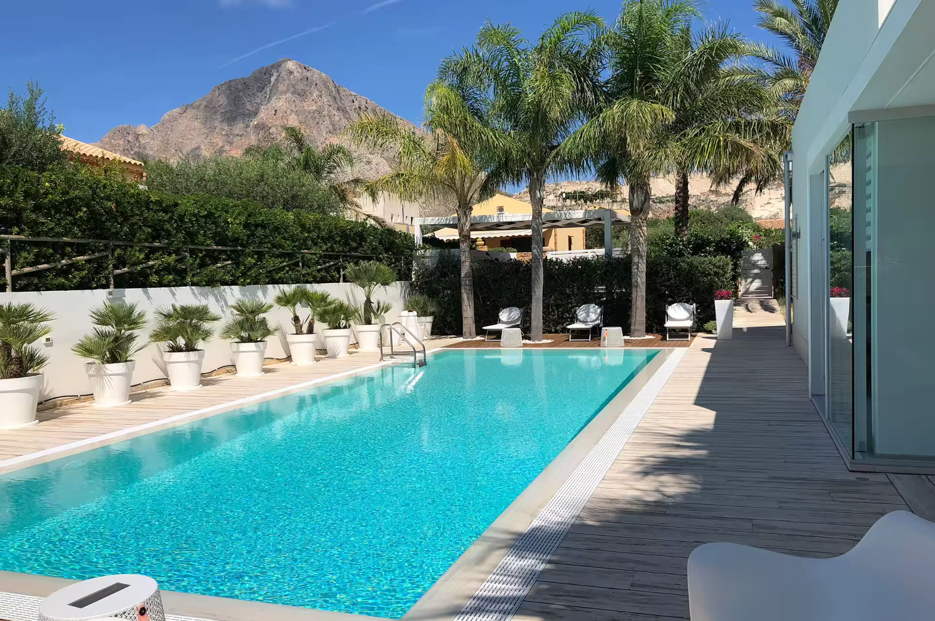 Large private pool with Mount Cofano beyond at Villa Spuma
