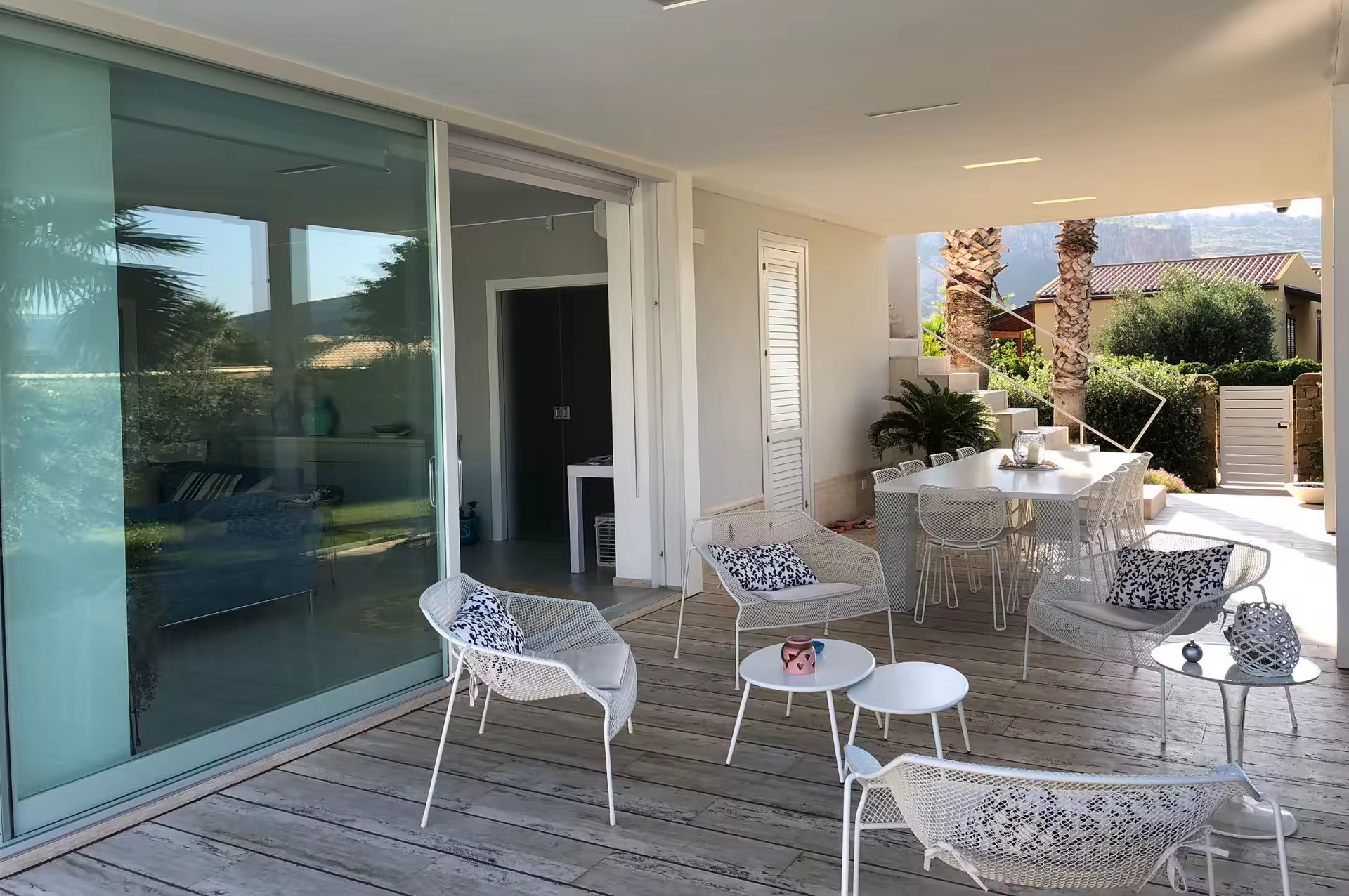 Covered outdoor dining and lounge terrace at Villa Spuma