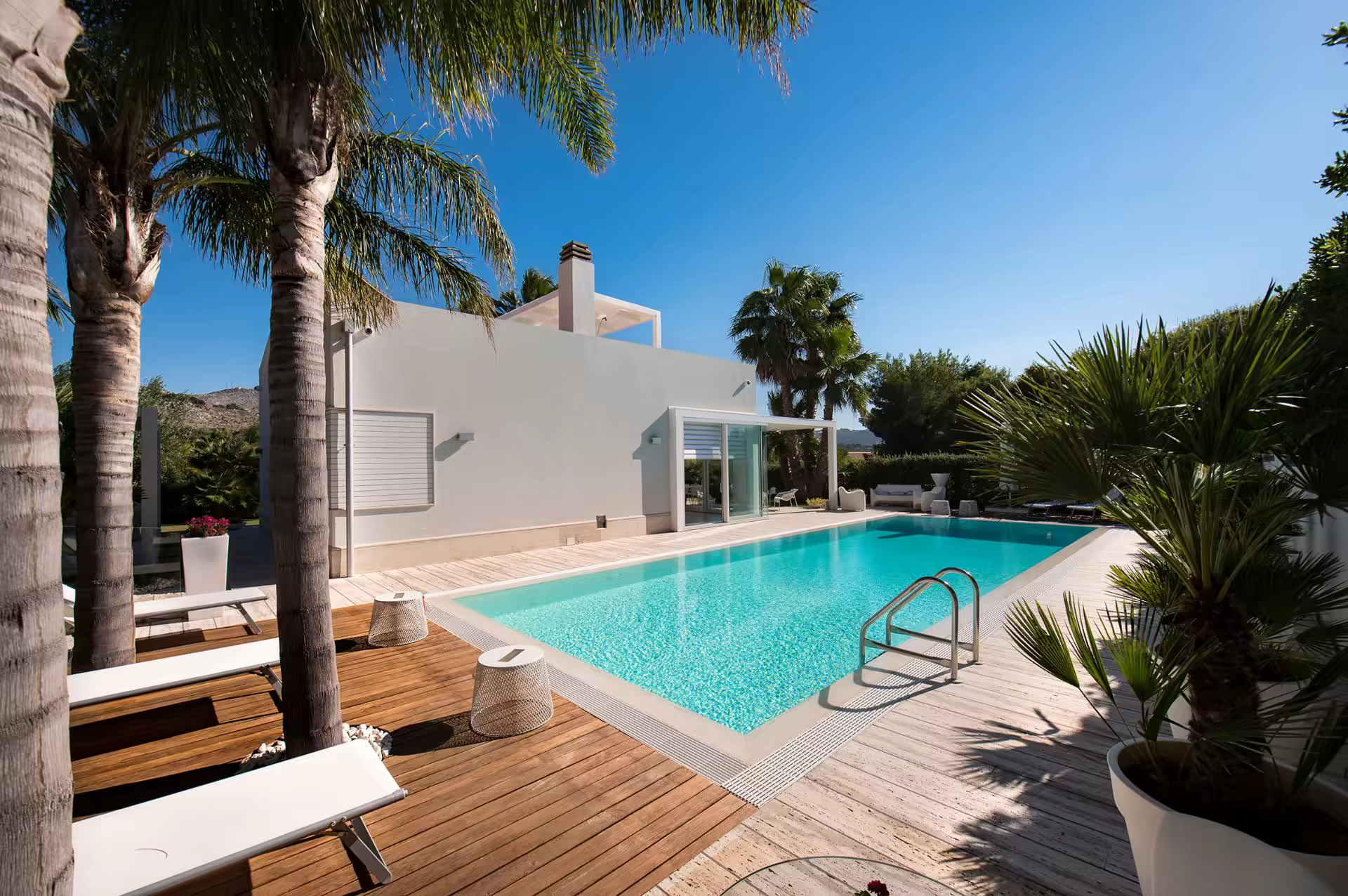 Wide view of the pool, garden and villa