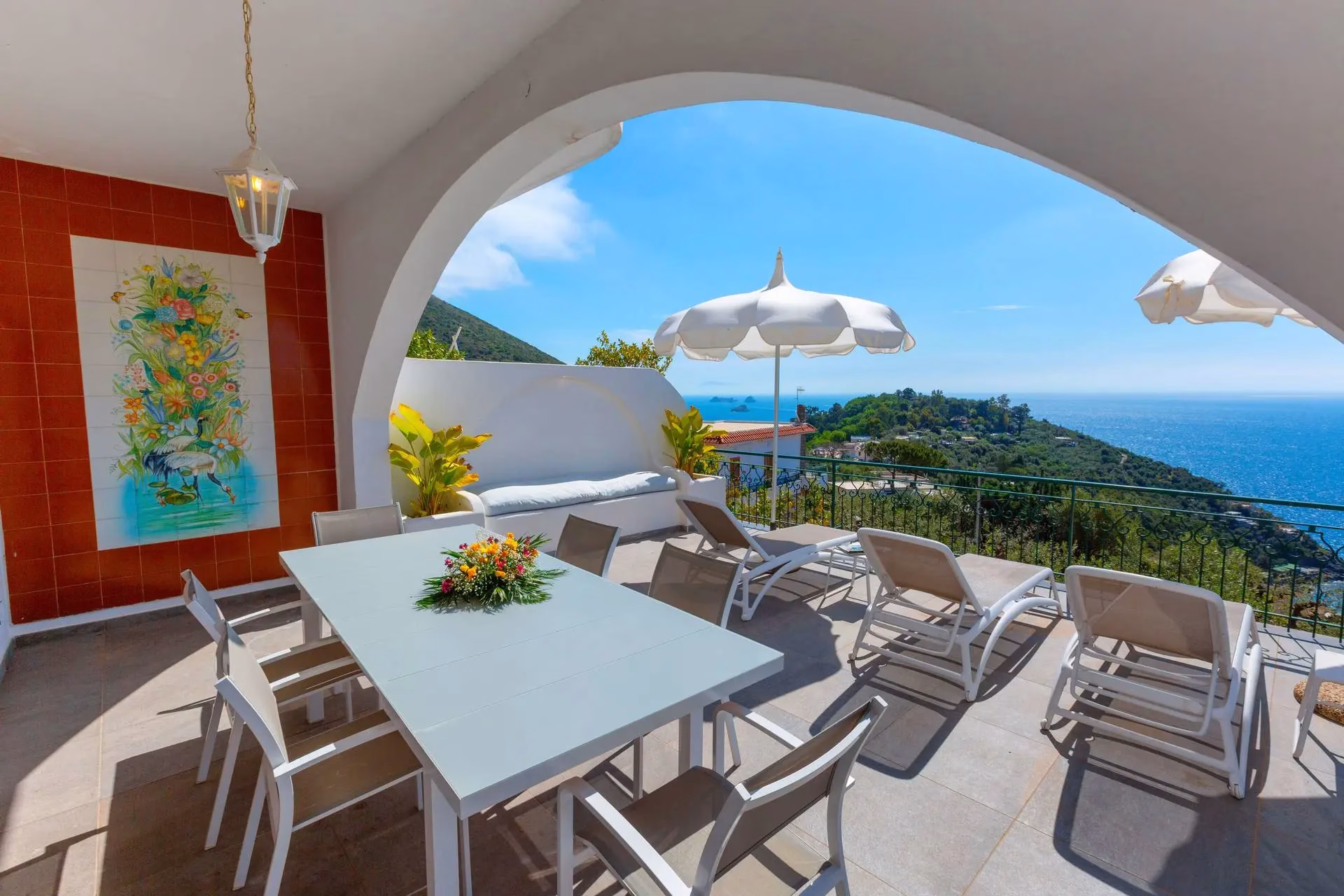 Covered outdoor dining terrace at Villa Mira