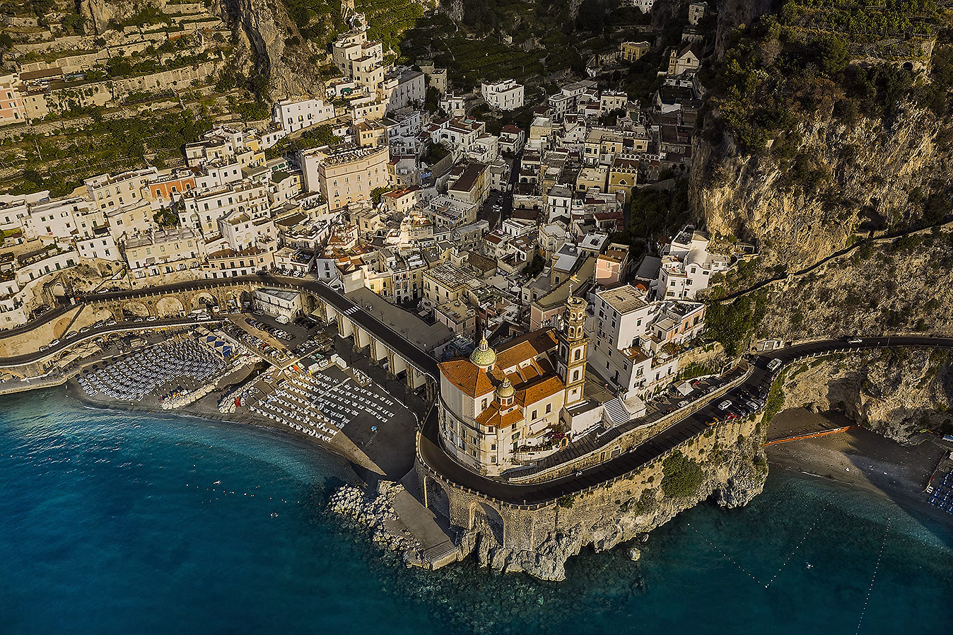 Atrani, its church and beach enclosed by steep hillsides