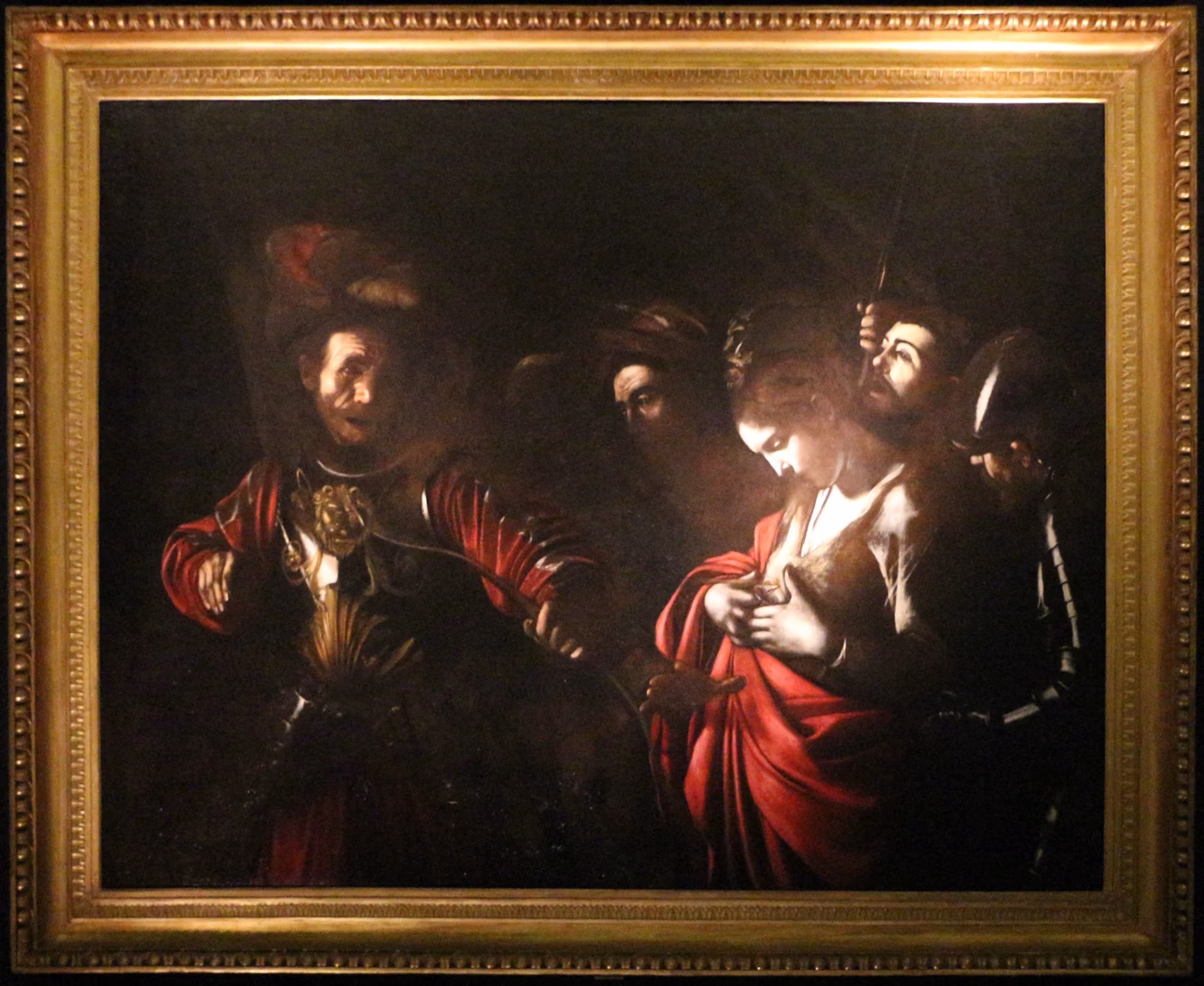 Caravaggio’s The Martyrdom of Saint Ursula, showing Ursula looking at her wound and the king holding a bow