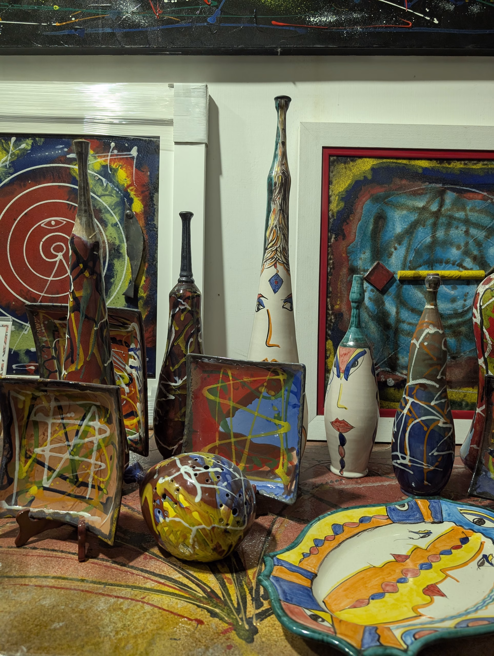 Colourful painted ceramic vases and plates displayed in Vietri sul Mare