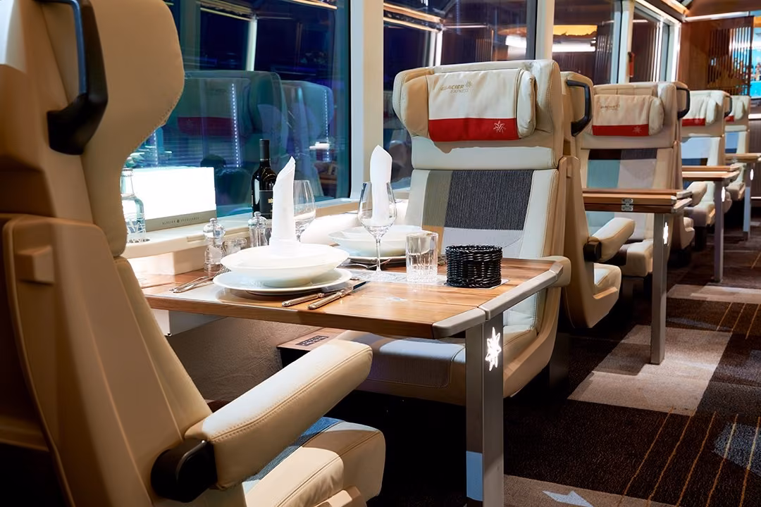 Reclining Excellence Class seats and a table laid for dining