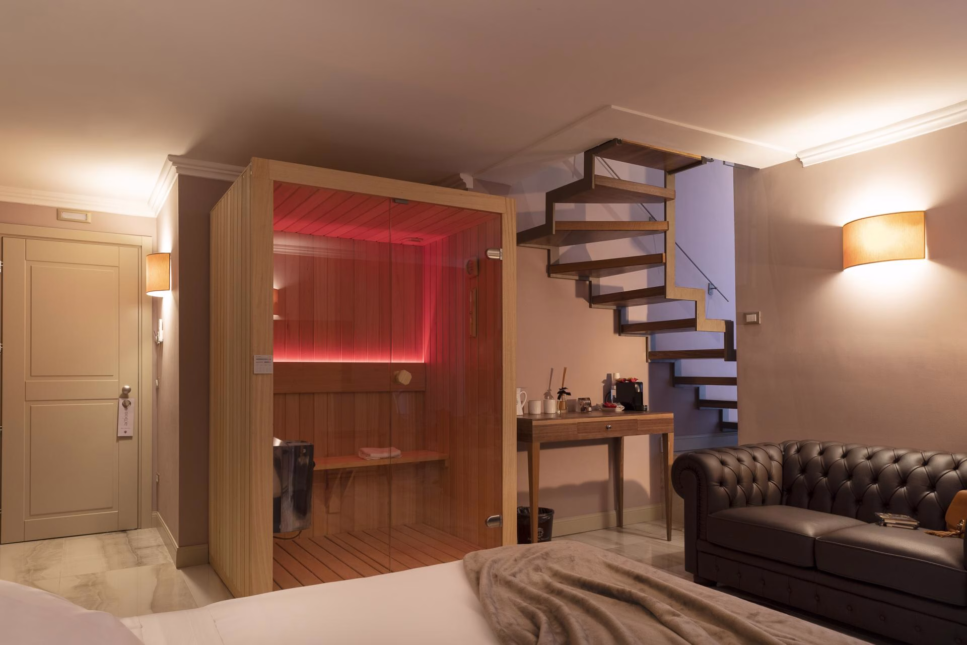 A Loft Suite Spa — sitting area, sauna and internal stairs