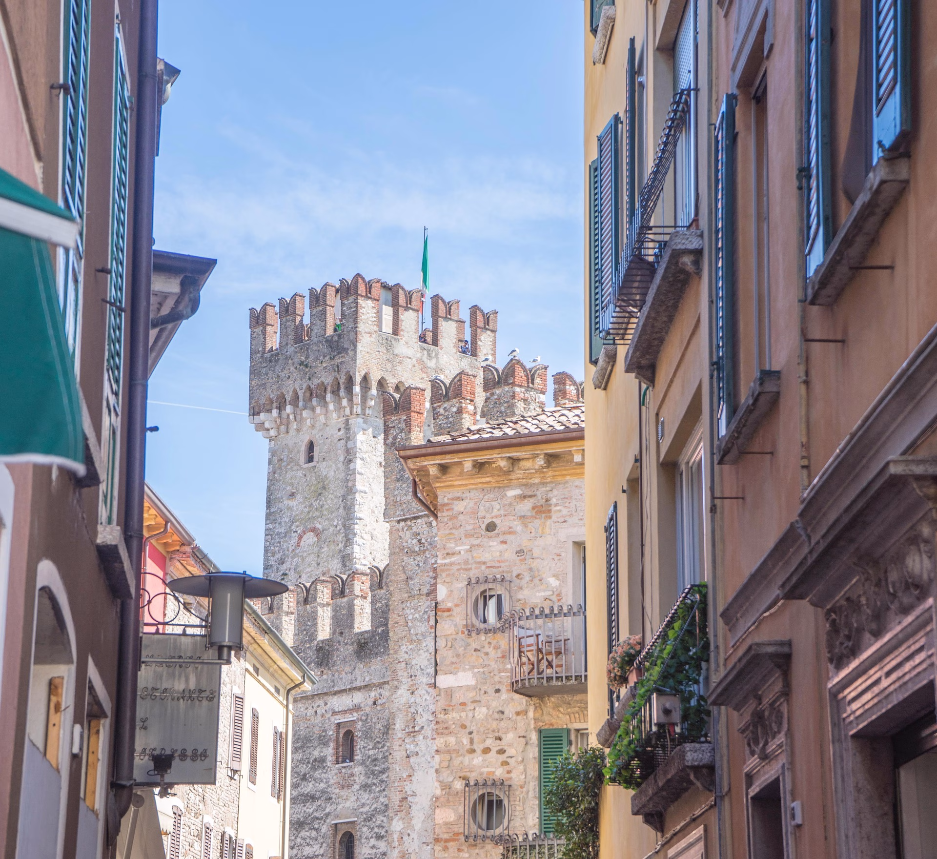 A glimpse of the castle between the old town’s buildings.