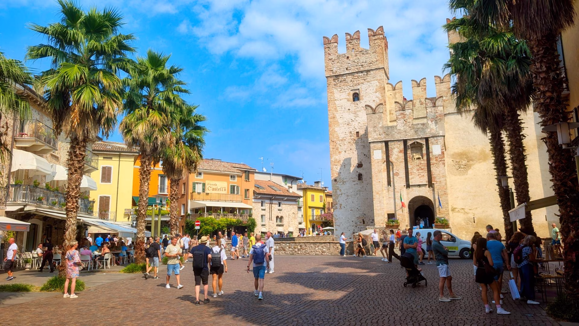 The square beside Scaligero Castle is a lively introduction to the old town.