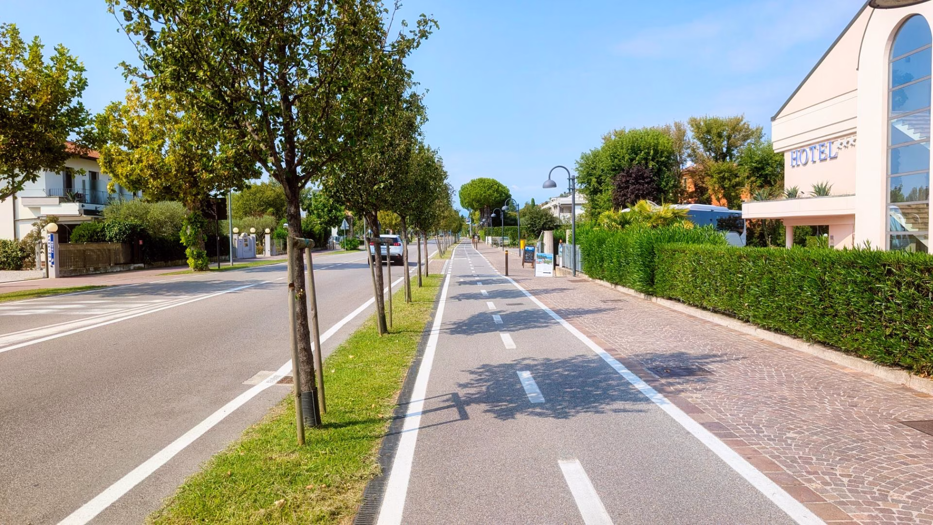 Separated cycle lane beside the road on the approach to Sirmione
