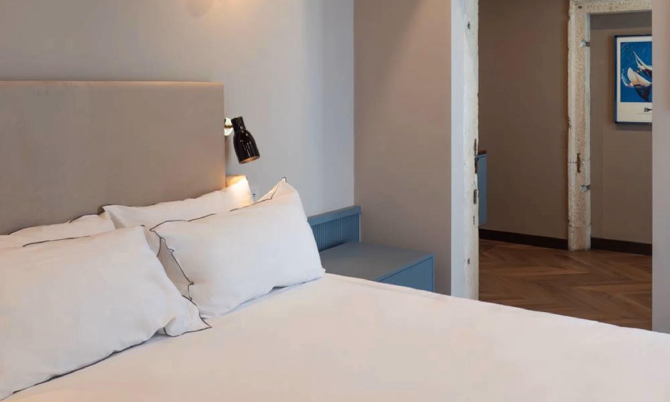Example Suite bedroom with a doorway to the adjoining area