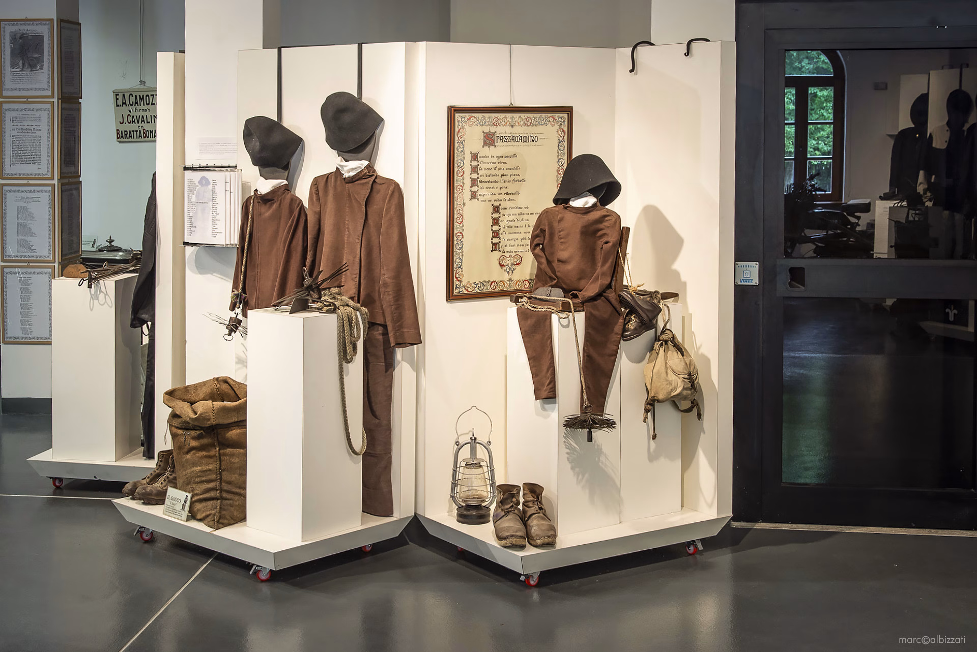 Traditional chimney-sweep clothing, brushes and work equipment in the Museo dello Spazzacamino